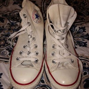Very worn white converse, still in good condition